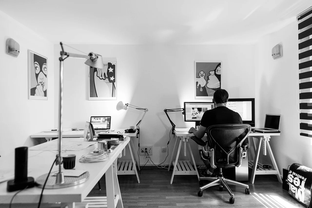 Computer on a desk in a web design workspace